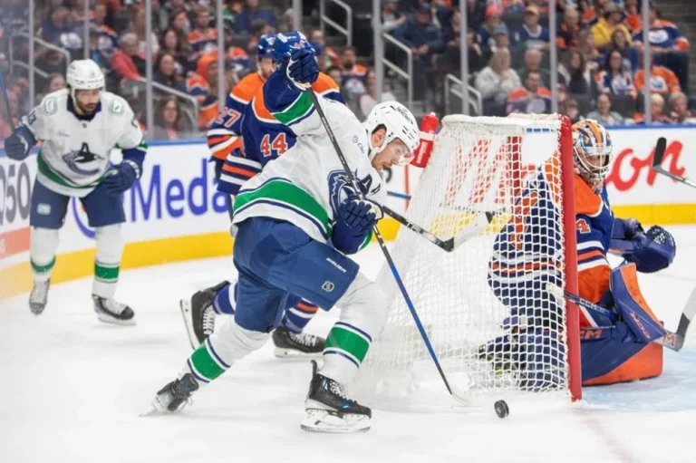 Vancouver Canucks Pius Suter looks for a shot against Edmonton Oilers goalie Stuart Skinner (74) during first period NHL pre-season action in Edmonton on Monday, Sept. 30, 2024. THE CANADIAN PRESS/Amber Bracken